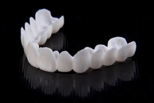 Customizable dental prosthesis with tooth lenses