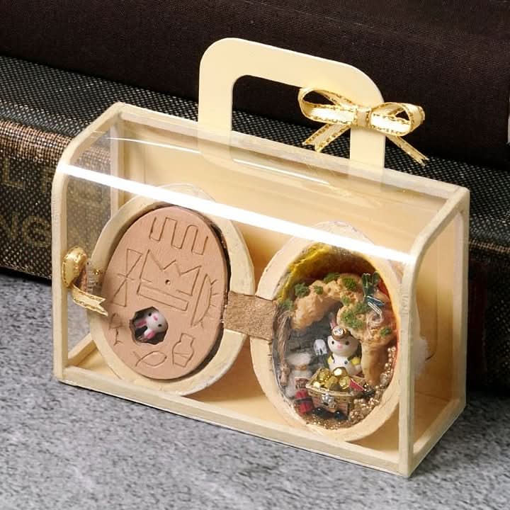 BowLift | Handcrafted dollhouse made from walnut shells with interior light