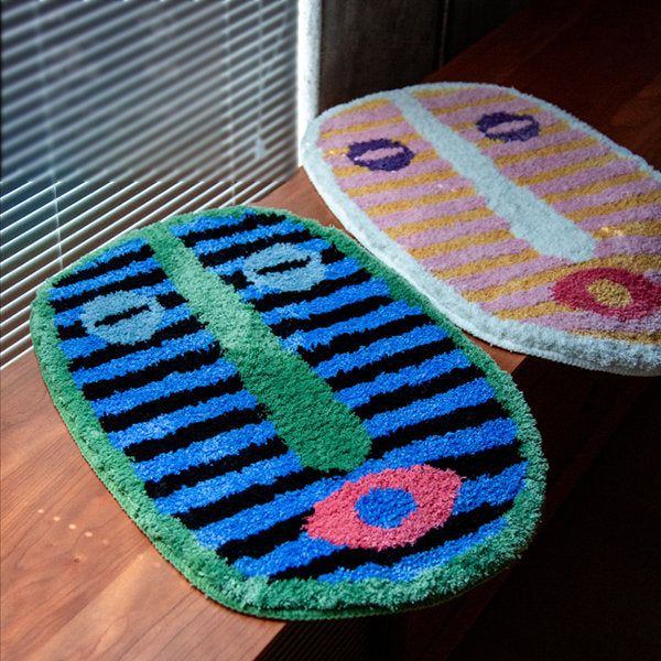 Bath mat abstract face
