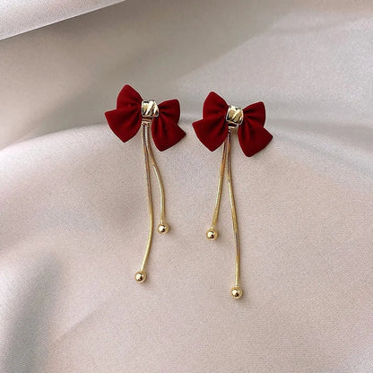 BowLift | Dainty Bow Gold Dangle Earrings