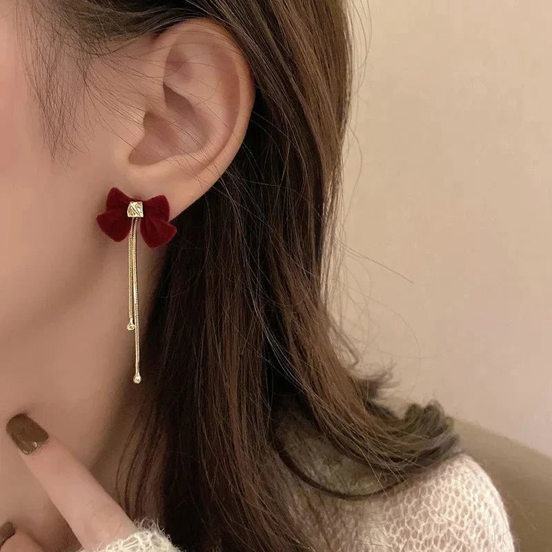 BowLift | Dainty Bow Gold Dangle Earrings