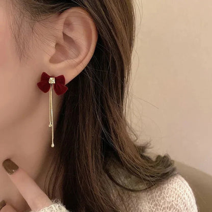 BowLift | Dainty Bow Gold Dangle Earrings