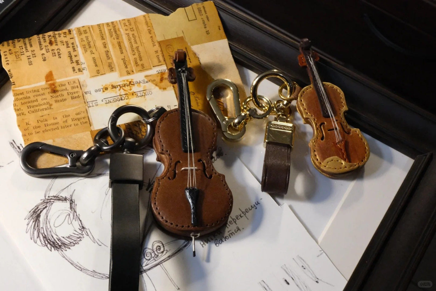 Crafted leather keychain with violin and cello