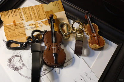 Crafted leather keychain with violin and cello