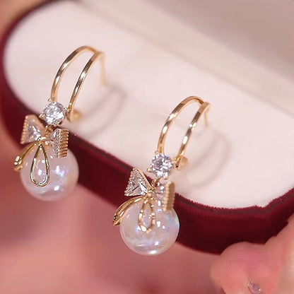 Skanto | Bow Pearl Earrings