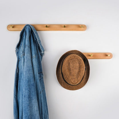 BowLift | WandHout – Minimalistic wooden wall coat rack with brass hooks