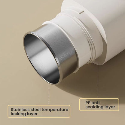 Travel mug with electric heating system