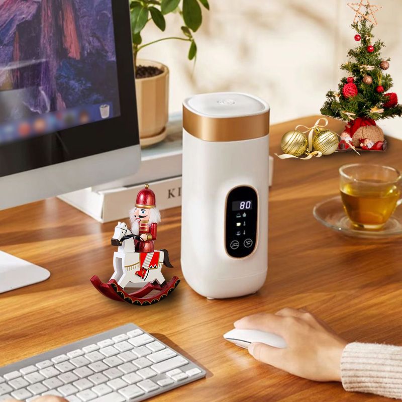 Travel mug with electric heating system