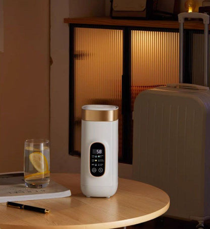 Travel mug with electric heating system