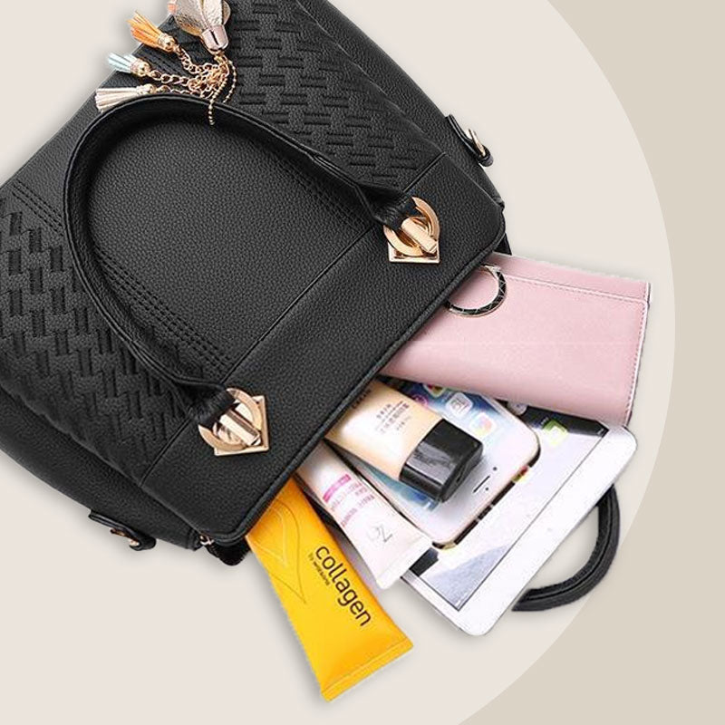 Elegant women's handbag with tassel charm
