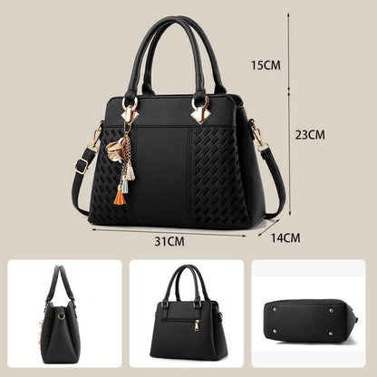 Elegant women's handbag with tassel charm