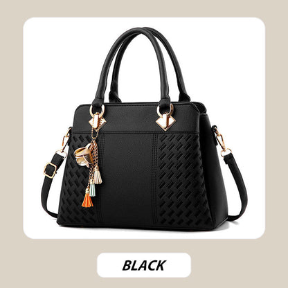 Elegant women's handbag with tassel charm