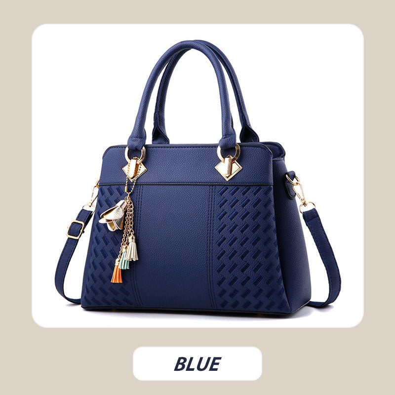 Elegant women's handbag with tassel charm