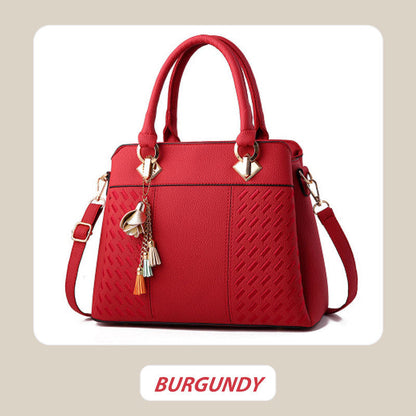 Elegant women's handbag with tassel charm