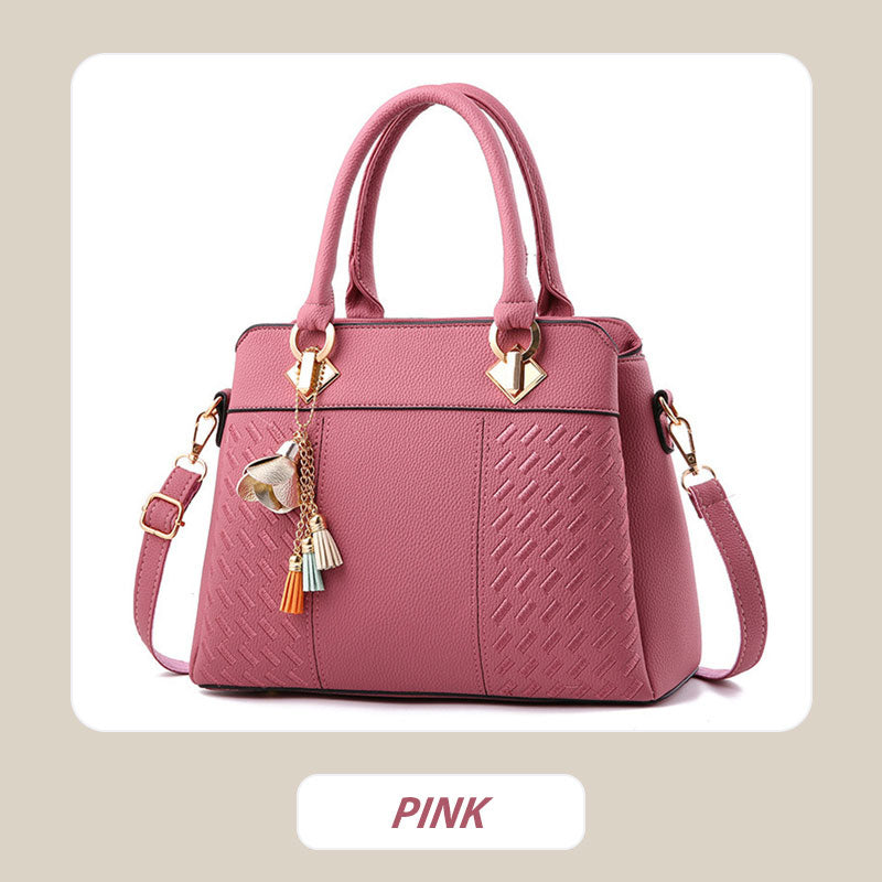 Elegant women's handbag with tassel charm