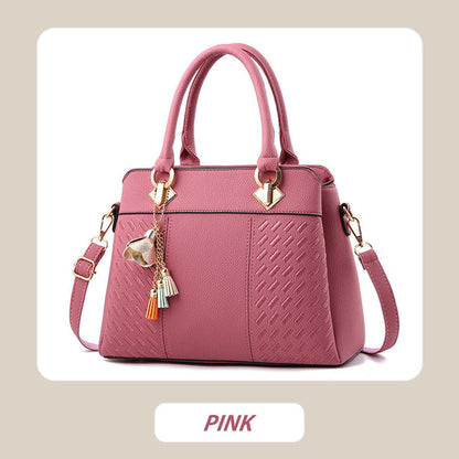 Elegant women's handbag with tassel charm